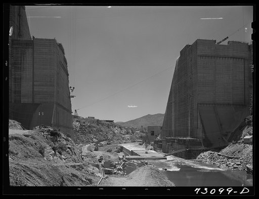 Shasta Dam, Shasta County, California. The two sides of the dam are fast bridging the gap through which the Sacramento River now flows