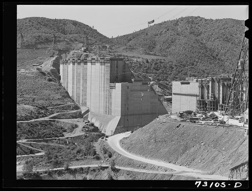 Untitled photo, possibly related to: Shasta Dam, Shasta County, California. The two sides of the dam are fast bridging the gap through which the Sacramento river now flows