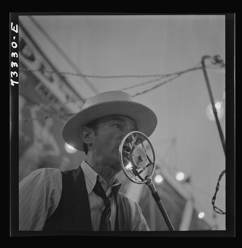 Klamath Falls, Oregon. Sideshow barker at the circus