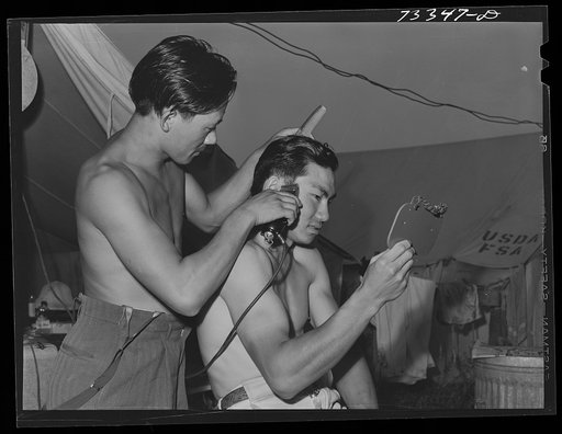 Nyssa, Oregon. FSA (Farm Security Administration) mobile camp. Japanese-Americans cut each other's hair. Under the agreement among the Japanese to FSA and those who sponsor the Japanese in the area (the United States Employment Service and the sugar beet companies), the Japanese can go into town onc