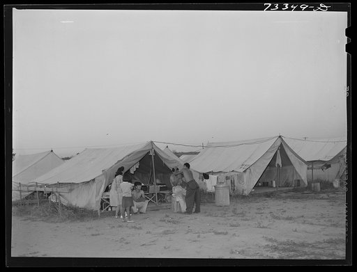 Nyssa, Oregon. FSA (Farm Security Administration) mobile camp. Ordinarily electricity is not supplied to the tents of migrant families living in the FSA camps. These Japanese-Americans, who were accustomed to better living conditions, wanted the electricity and the sugar beet companies and the town 