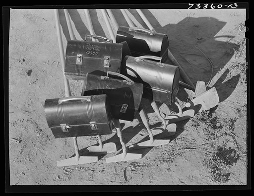 Untitled photo, possibly related to: Nyssa, Oregon. Lunch boxes and hoes of one family of Japanese-Americans who live at the FSA (Farm Security Administration) mobile camp go to town one night a week for three hours in a supervised group