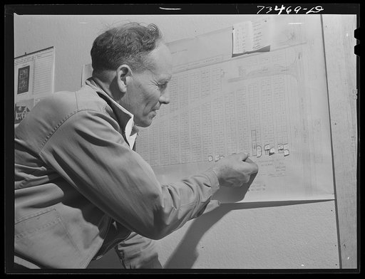 Seneca, Oregon. Agent of the metal reserves company marks a new plot which has just been assigned to chrome ore delivered to the ore purchasing depot