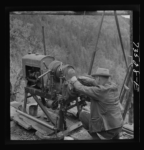 Grant County, Oregon. Bureau of Mines representative taking bearing on angle of diamond drilling for chrome ore deposits