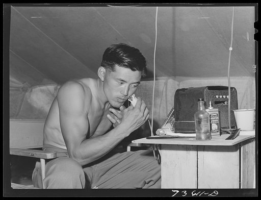 Nyssa, Oregon. FSA (Farm Security Administration) mobile camp. Japanese-American boy who lives at the camp. These people volunteered to leave the reception centers to do farm work. When it was apparent that they would not be satisfied to stay unless they had electricity in individual camps, the suga