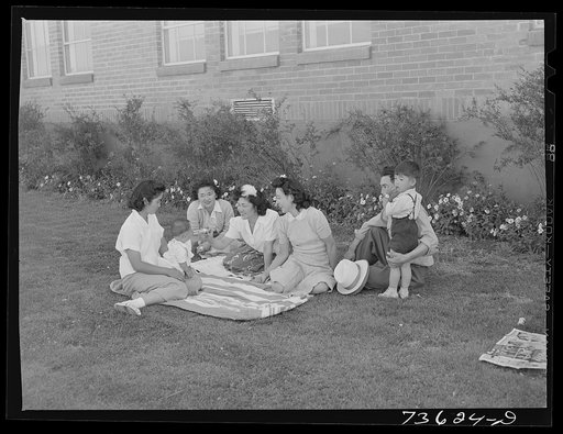 Untitled photo, possibly related to: Nyssa, Oregon. Japanese-Americans at baseball game. They live at the FSA (Farm Security Administration) mobile camp. On Sundays, the Japanese-Americans come into town in a supervised group to attend a special run picture show and use the baseball field