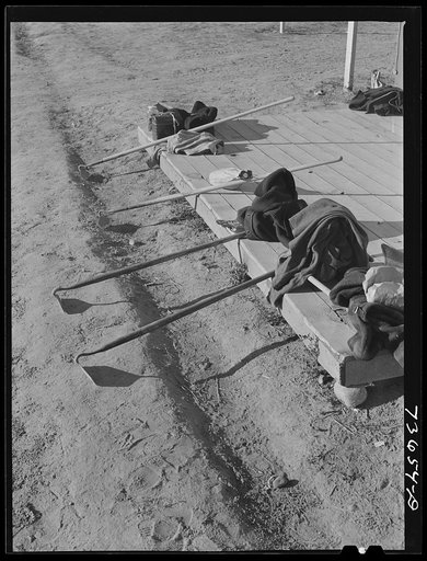 Nyssa, Oregon. FSA (Farm Security Administration) mobile camp. Hoes, lunch baskets, Japanese-American farm workers who live at the camp