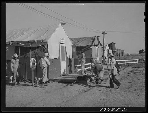 Nyssa, Oregon. FSA (Farm Security Administration) mobile camp. Japanese-Americans clean up their tent home