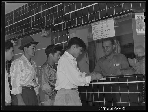 Nyssa, Oregon. Japanese-Americans who live at the FSA (Farm Security Administration) mobile camp attend a special run picture show on Sunday