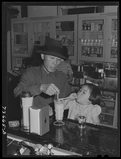 Nyssa, Oregon. Japanese-American farm workers have an ice cream soda on weekly trip to town