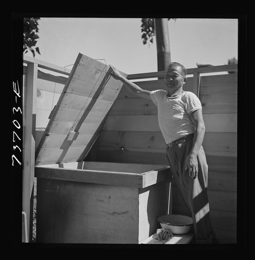 Untitled photo, possibly related to: Malheur County, Oregon. Japanese-American who lives with his family on a farm as a tenant and a day laborer, building a Japanese bath