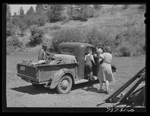 Ola, Idaho. FSA (Farm Security Administration) Ola self-help cooperative. A member and his family starts to town