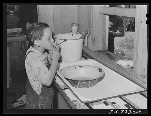 Ola, Idaho. FSA (Farm Security Administration) Ola self-help cooperative. Son of a member. The members are slowly but continually improving their houses