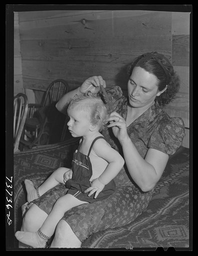 Ola, Idaho. FSA (Farm Security Administration) Ola self-help cooperative. Wife of a member and his son