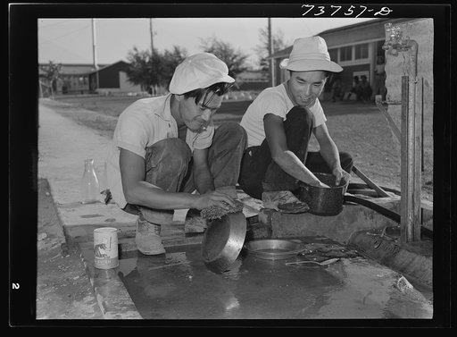 Twin Falls, Idaho. FSA (Farm Security Administration) farm workers' camp. Japanese washing dishes