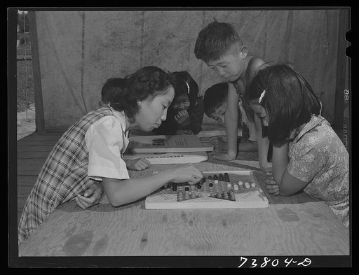 Shelley, Idaho. FSA (Farm Security Administration) mobile camp. Japanese girls playing Chinese checkers