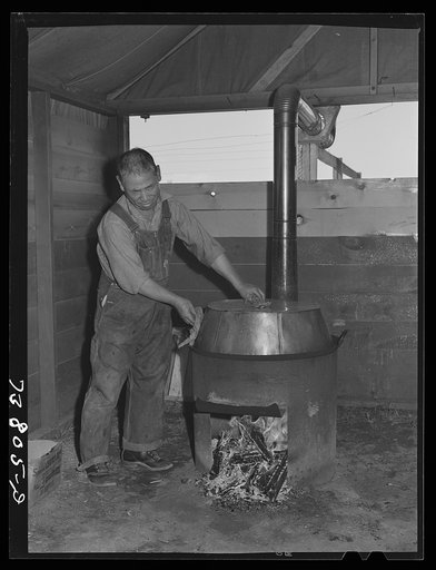 Shelley, Idaho. FSA (Farm Security Administration) mobile camp. Cooking big pot of rice for the cooperative mess of the Japanese living at the camp
