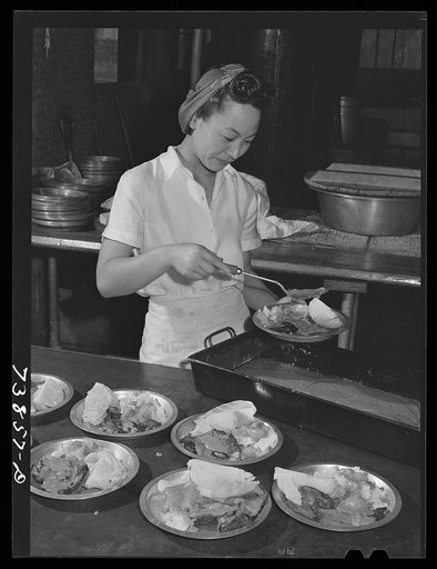 Rupert, Idaho. Former CCC (Civilian Conservation Corps) camp now under FSA (Farm Security Administration) management. Dishing up supper in the community mess hall of the Japanese-Americans