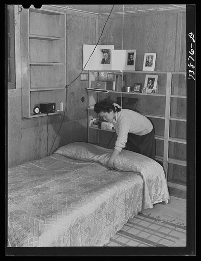 Rupert, Idaho. Former CCC (Civilian Conservation Corps) camp now under FSA (Farm Security Administration) management. A Japanese-American girl in the apartment she has arranged for her husband and herself in the barracks building