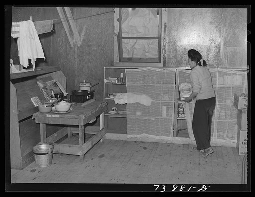 Rupert, Idaho. Former CCC (Civilian Conservation Corps) camp now under FSA (Farm Security Administration) management. A Japanese-American girl in the apartment she has arranged for her husband and herself in the barrack building