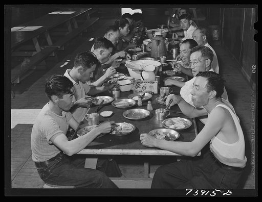 Untitled photo, possibly related to: Rupert, Idaho. Former CCC (Civilian Conservation Corps) camp now under FSA (Farm Security Administration) management. Japanese-Americans eating supper in the community mess hall