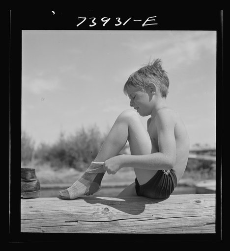 Untitled photo, possibly related to: Rupert, Idaho. Schoolboy at swimming pool