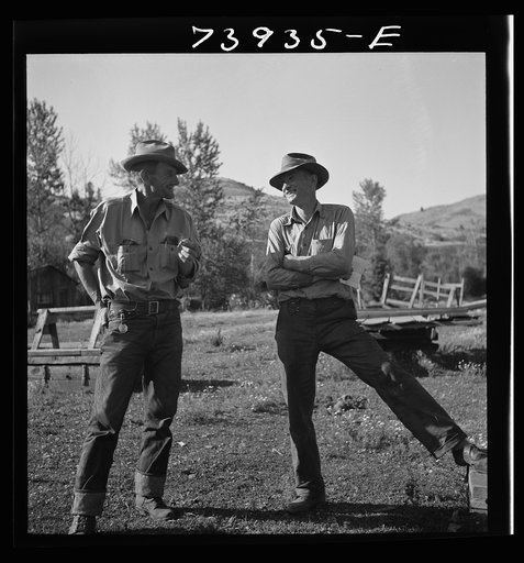 Ola, Idaho. Member of the Ola self-help cooperative talking to a customer of the cooperative sawmill