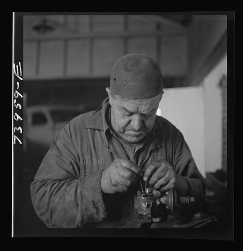Burley, Idaho. Mechanic in garage