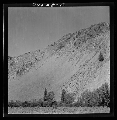 Untitled photo, possibly related to: Salmon River Valley narrows and the mountains rise abruptly from the valley floor. Custer County, Idaho