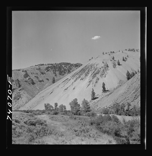 Untitled photo, possibly related to: Salmon River Valley narrows and the mountains rise abruptly from the valley floor. Custer County, Idaho