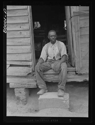 FSA (Farm Security Administration) borrower resting in the doorway of his one-room house. He lives here with two sons and a sister-in-law. Ridge, Maryland. Saint Mary's County