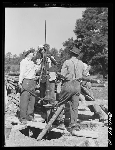 Untitled photo, possibly related to: One and a quarter drop pipe ready to be inserted in casing. Safe well demonstration near La Plata, Maryland, Charles Count