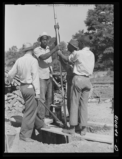 One and a quarter drop pipe ready to be inserted in casing. Safe well demonstration near La Plata, Maryland, Charles County