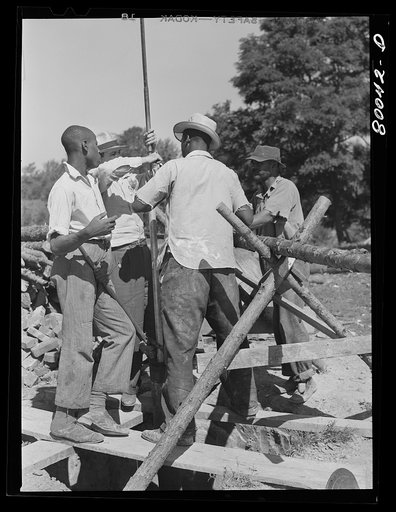 Untitled photo, possibly related to: One and a quarter drop pipe ready to be inserted in casing. Safe well demonstration near La Plata, Maryland, Charles County