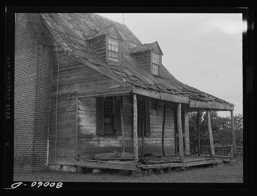 Front porch. No one dares sit out here anymore. John Briscoe farmhouse near Ridge, Maryland. Saint Mary's County