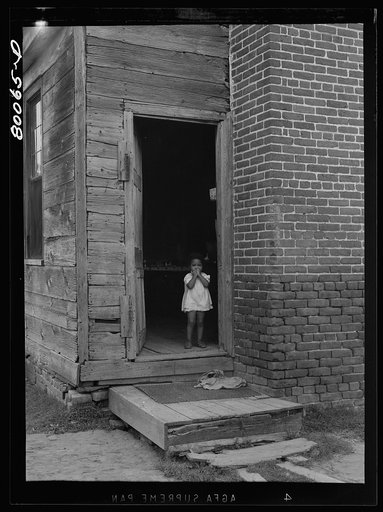 An unscreened door is an invitation for flies and illness near La Plata, Maryland. Charles County