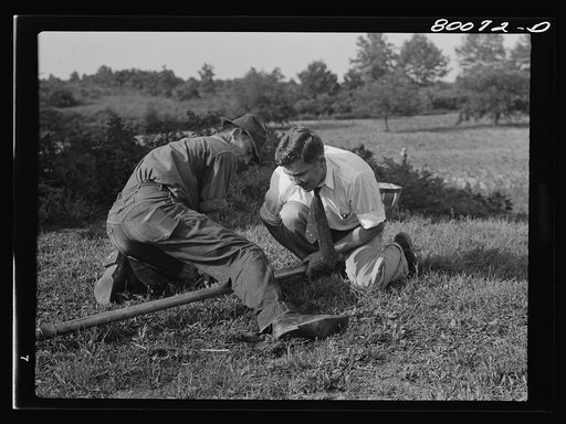 Coupling drop pipe. Safe well demonstration near La Plata, Maryland. Charles County