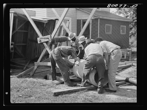 The second section of pipe is ready. Holes are drilled for easy handling. Safe well demonstration near La Plata, Maryland. Charles County