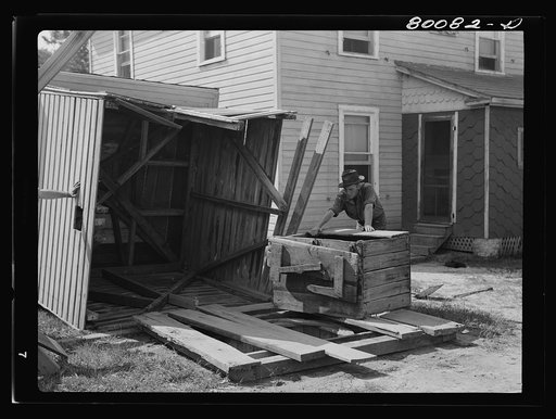 Removing the house and well cover. Safe well demonstration near La Plata, Maryland. Charles County