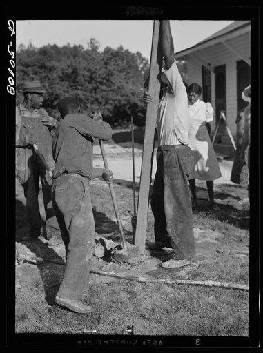 Tamping down gravel fill. Ridge well project, Saint Mary's County, Maryland