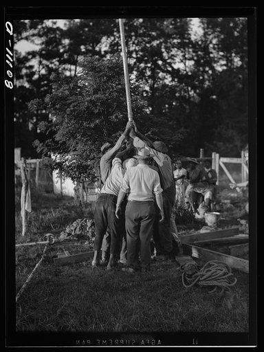 Drop pipe is lowered into casing. Ridge well project, Saint Mary's County, Maryland