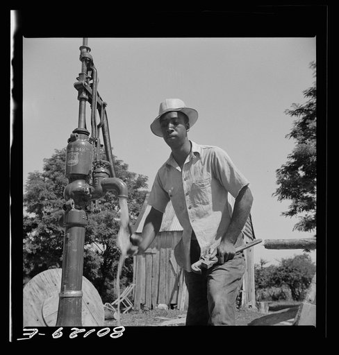 Well worker tries out the pump. John Fredrick well project, Saint Mary's County, Maryland
