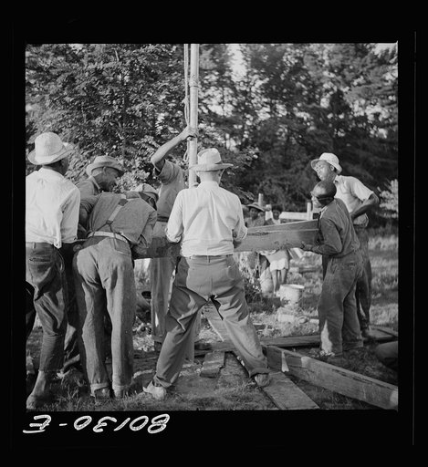 Well casing is drawn out of ground for an adjustment. Ridge well project, Saint Mary's County, Maryland