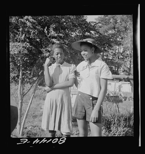 Untitled photo, possibly related to: Everybody tries to learn. White FSA (Farm Security Administration) engineer rigs pump. Ridge well project, Saint Mary's County, Maryland