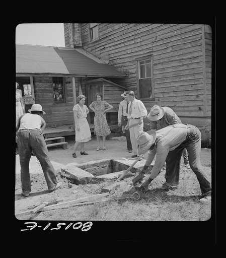 Wooden well top has been removed, exposing cement retaining wall. John Hardesty well project, Charles County, Maryland