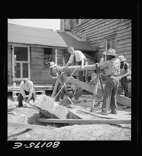 Removing a large block of old concrete. Safe well demonstration near La Plata, Maryland. Charles County