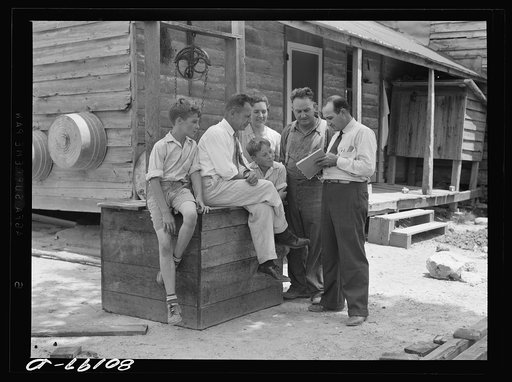 Well engineer and county supervisor talking over home plan. Charles County, Maryland