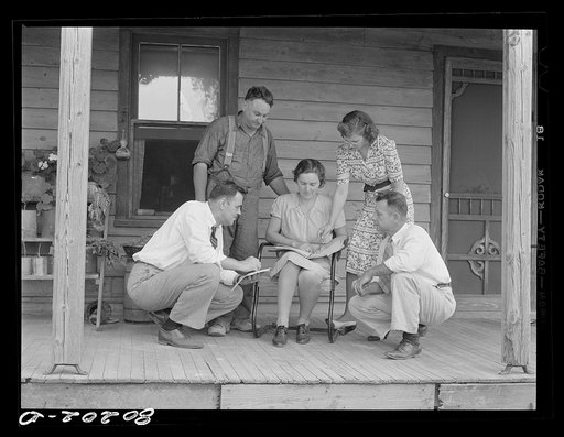 Health officer, county supervisor and supervisor of home economics discuss home plan with the Hardesty family. Charles County, Maryland