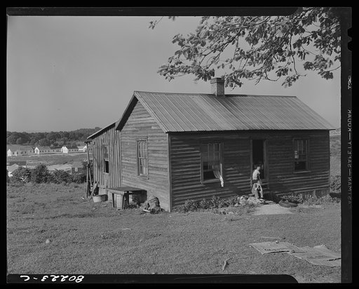 Rented house which will be torn down to make way for homes for defense workers of the expanding FSA (Farm Security Administration) housing project of Radford, Virginia. From nine days to as little as four days notice has been given to tenants and landholders before construction gangs tore down their
