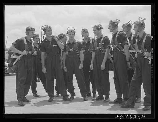 Cadets ready to mount into their planes after a hearty dinner of fried chicken. Craig Field, Southeastern Air Training Center, Selma, Alabama